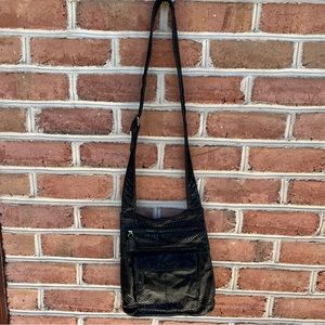 Black lightweight Crossbody bag, lots of zipper pockets Excellent for traveling.